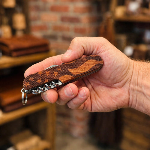American Flag Engraved Pocket Knife held in hand for scale