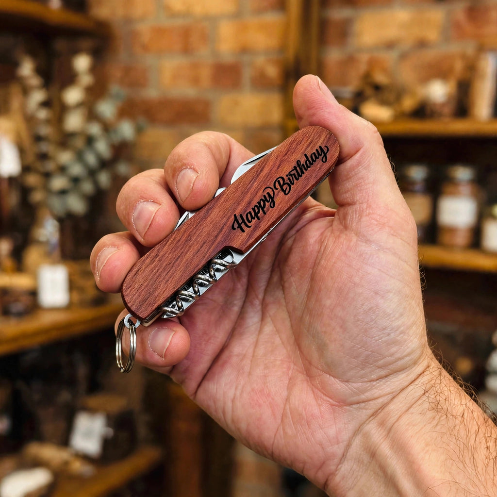 Happy Birthday Engraved Pocket Knife held in hand for scale