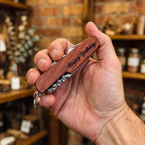 Happy Birthday Engraved Pocket Knife held in hand for scale