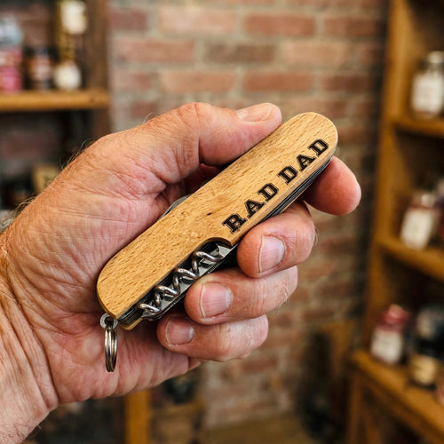 Rad Dad Engraved Pocket Knife held in hand for scale