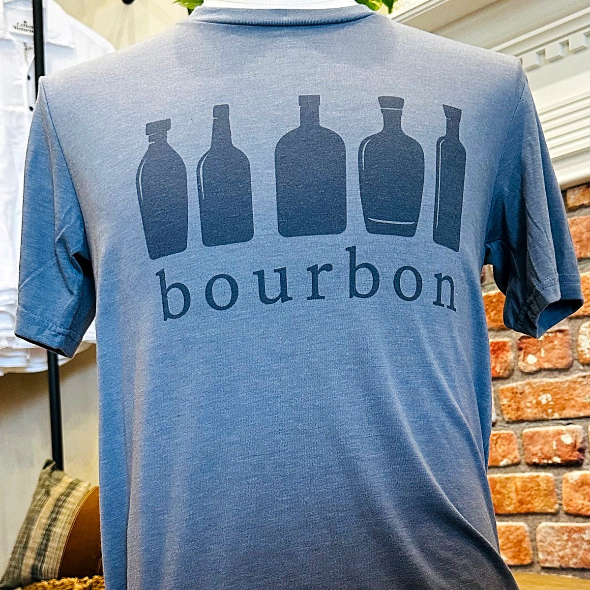 Bourbon Bottles Tee in blue on mannequin