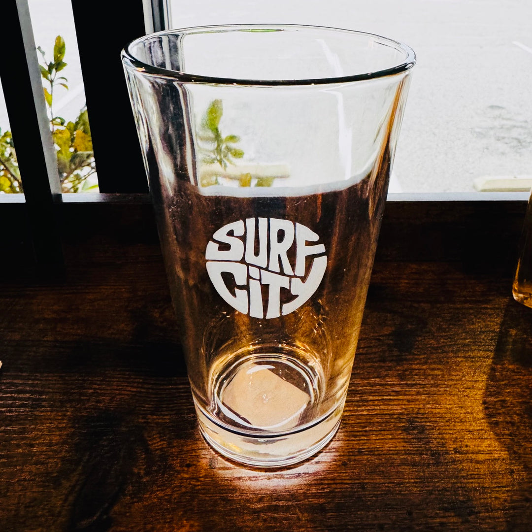 Surf City pint glass with circle logo