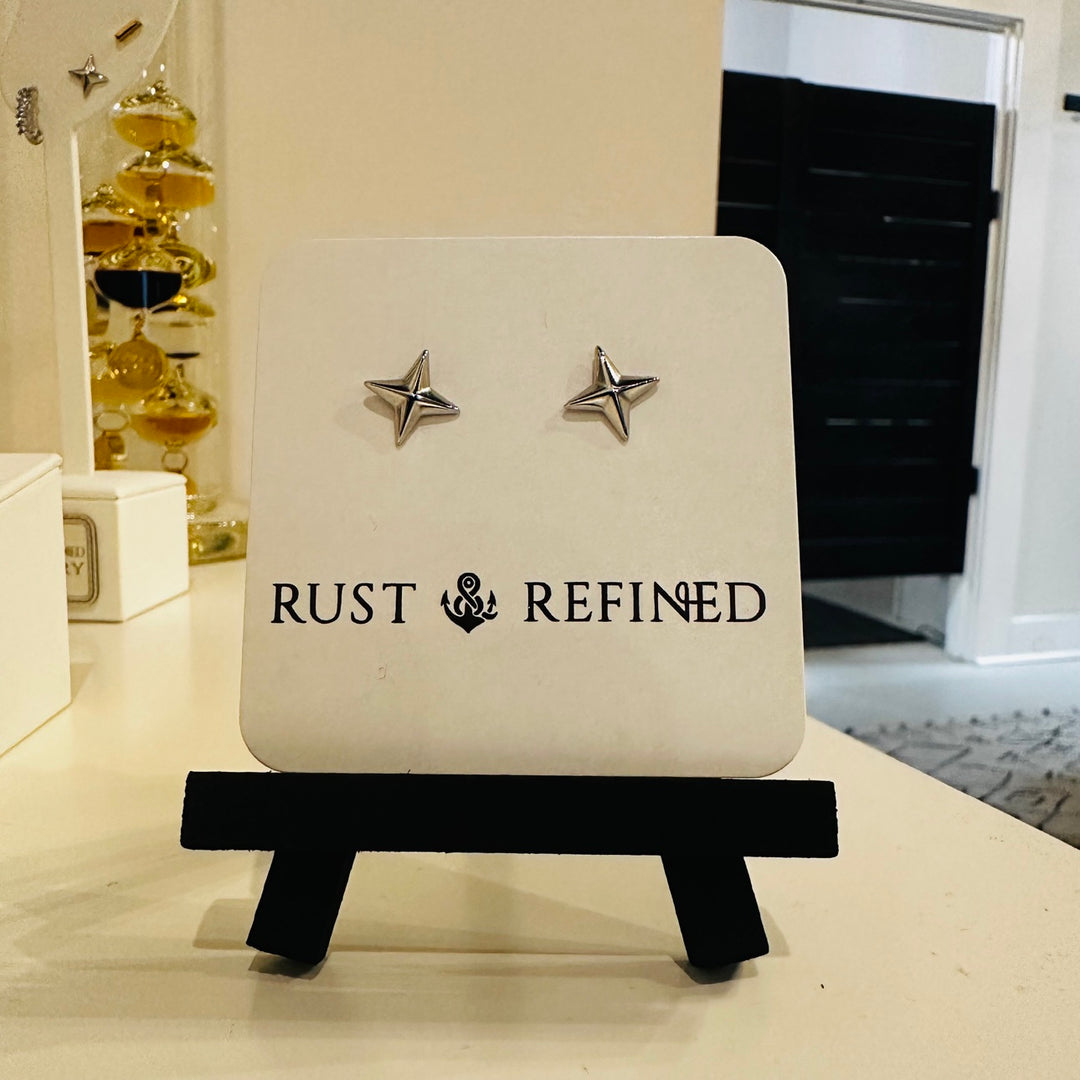 Silver star stud earrings on Rust and Refined card