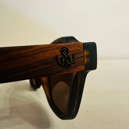 Anchor logo engraved on wooden sunglasses temple