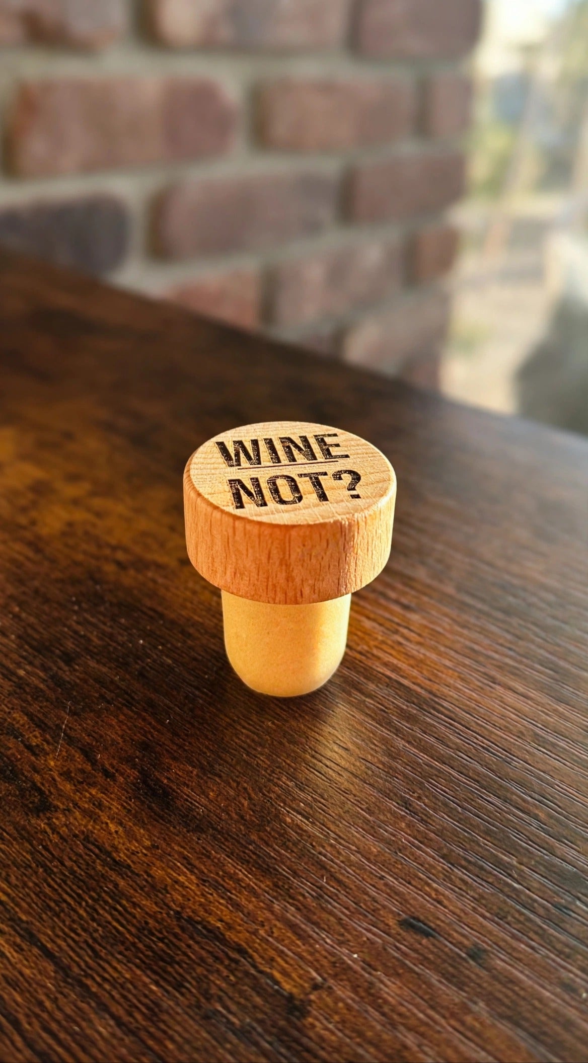 Wine Not? Wine Stopper on a dark wood counter