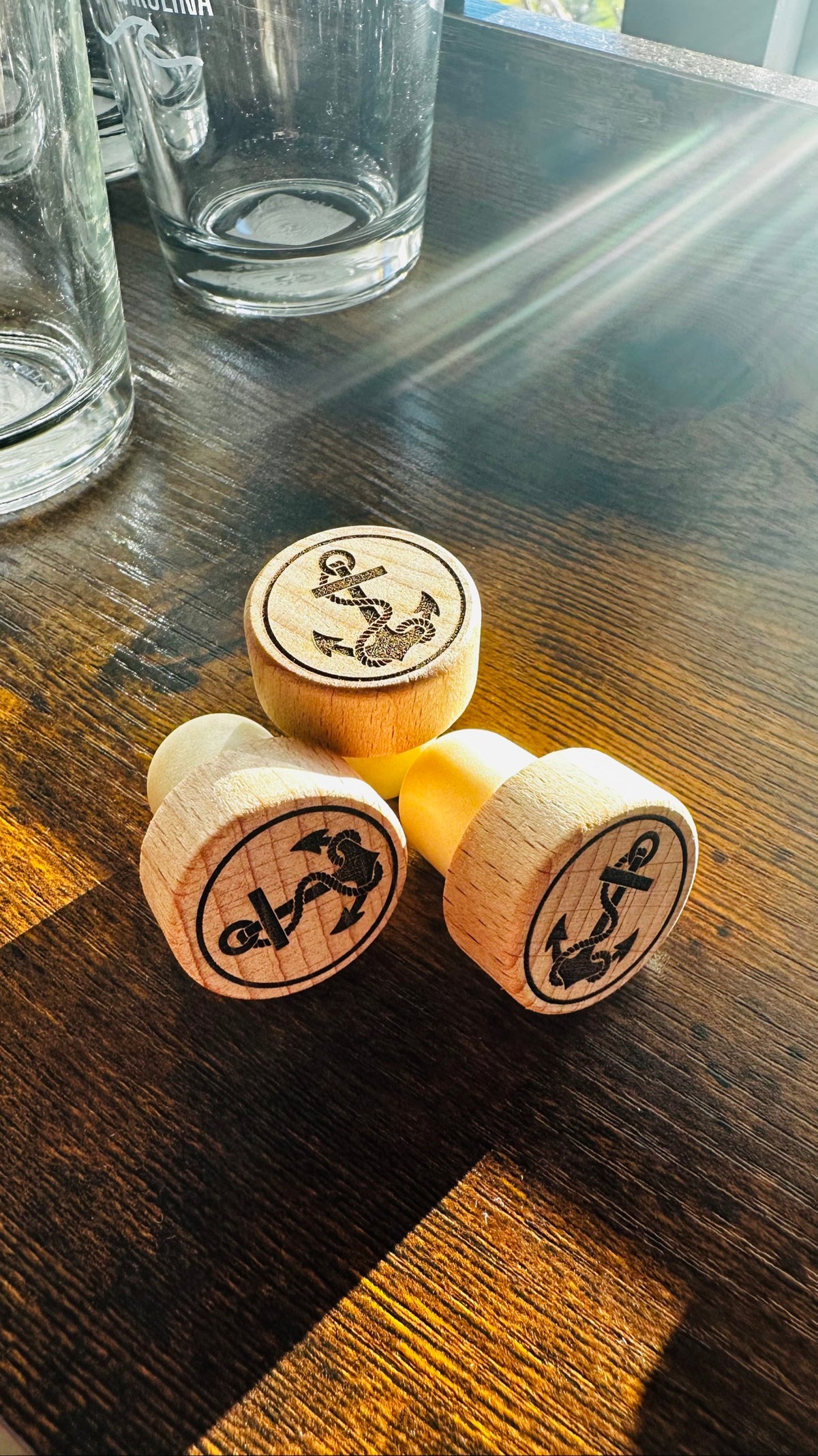 Anchor Wine Stopper, engraved wood stoppers on a dark wood counter